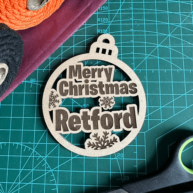 Merry Christmas "Retford" Bauble (Laser cut wooden and hand finished Christmas decoration)