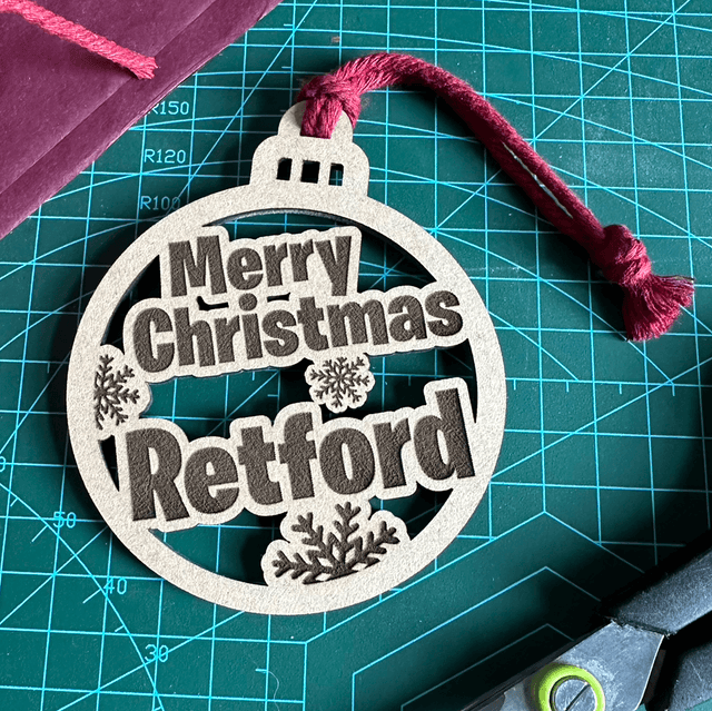 Merry Christmas &quot;Retford&quot; Bauble (Laser cut wooden and hand finished Christmas decoration)
